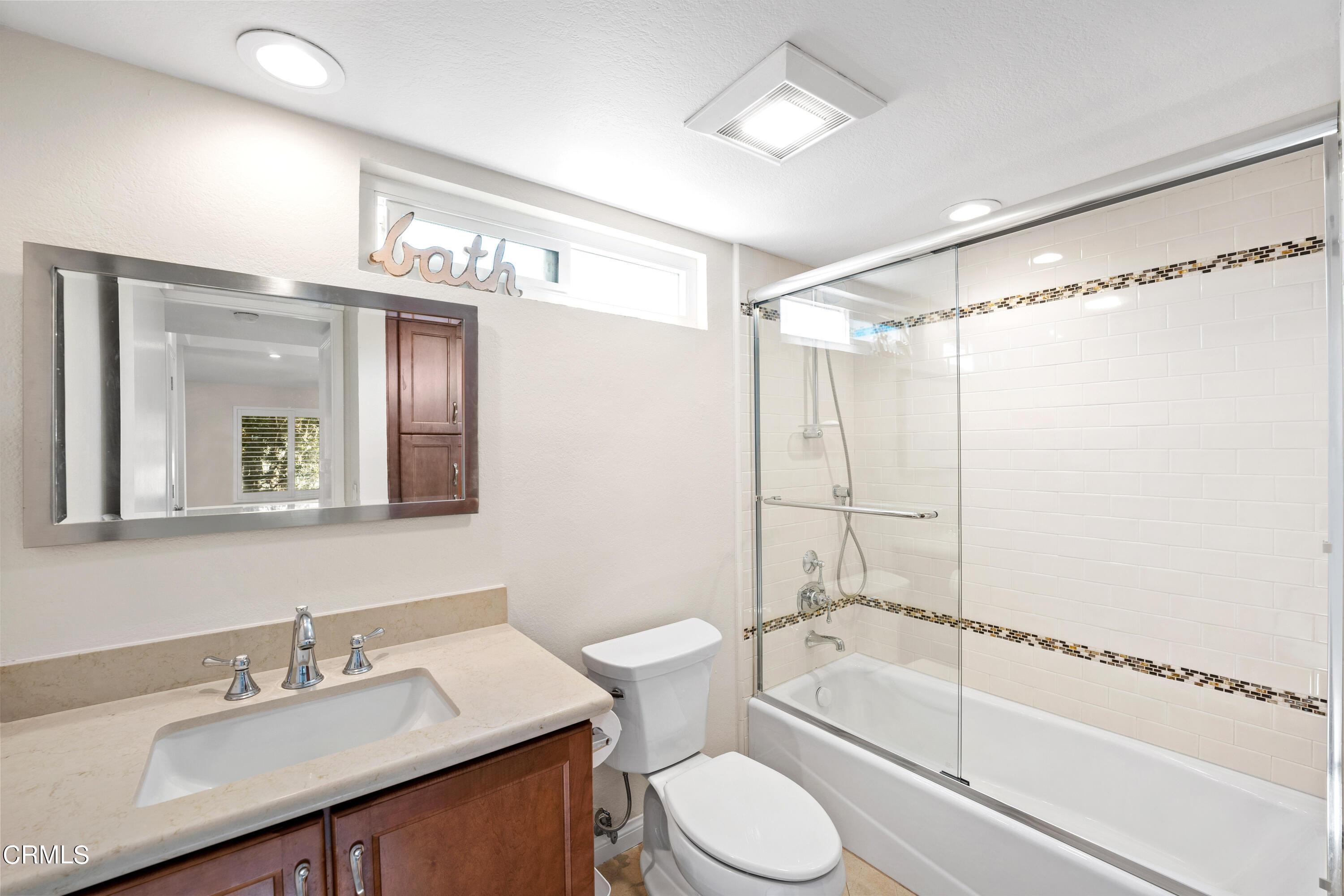 2263 Martinique Lane Oxnard, CA 93035 - Photo 21 of 38 a bathroom with a granite countertop bathtub shower sink vanity and toilet