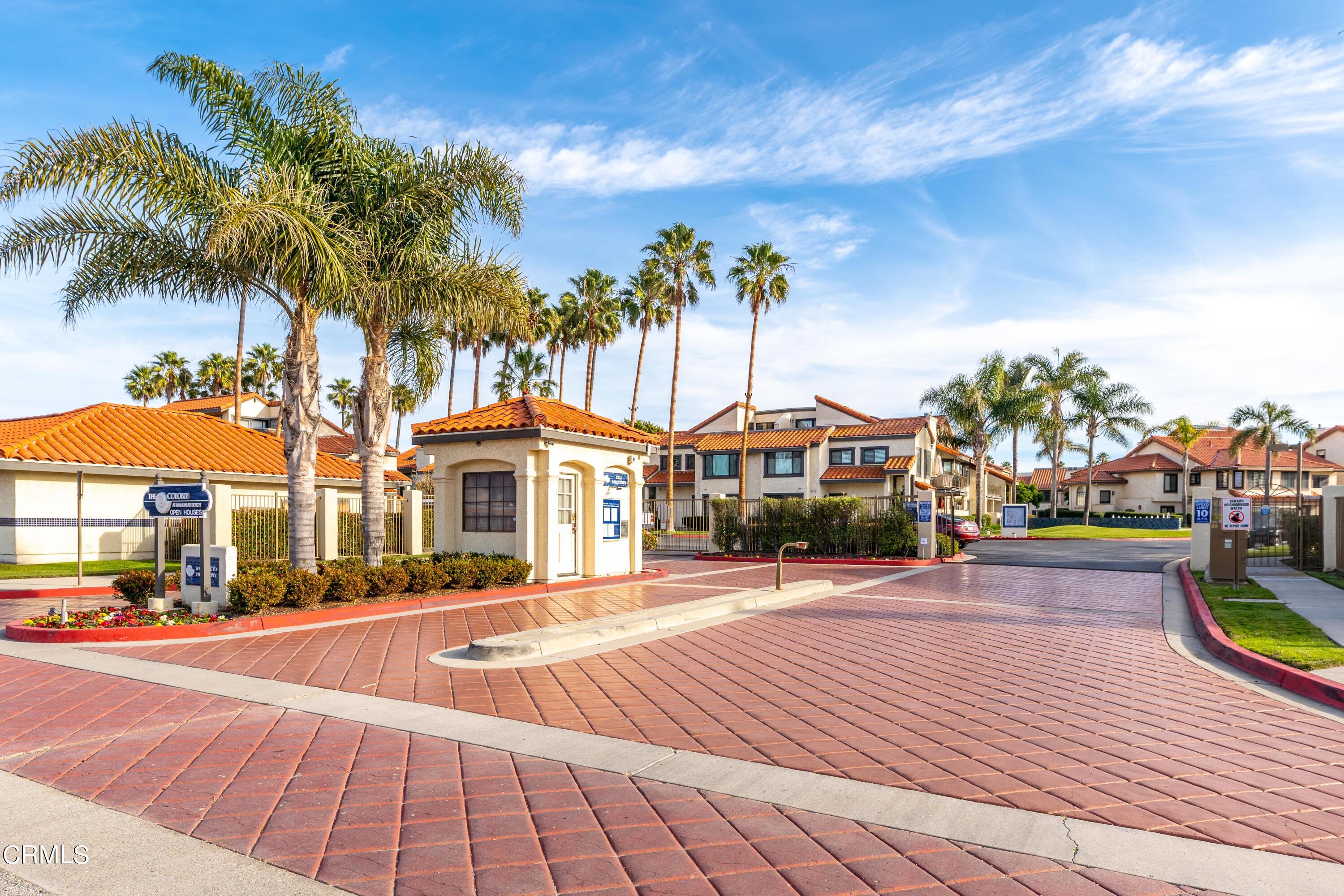 2263 Martinique Lane Oxnard, CA 93035 - Photo 25 of 38 a front view of a house with palm trees
