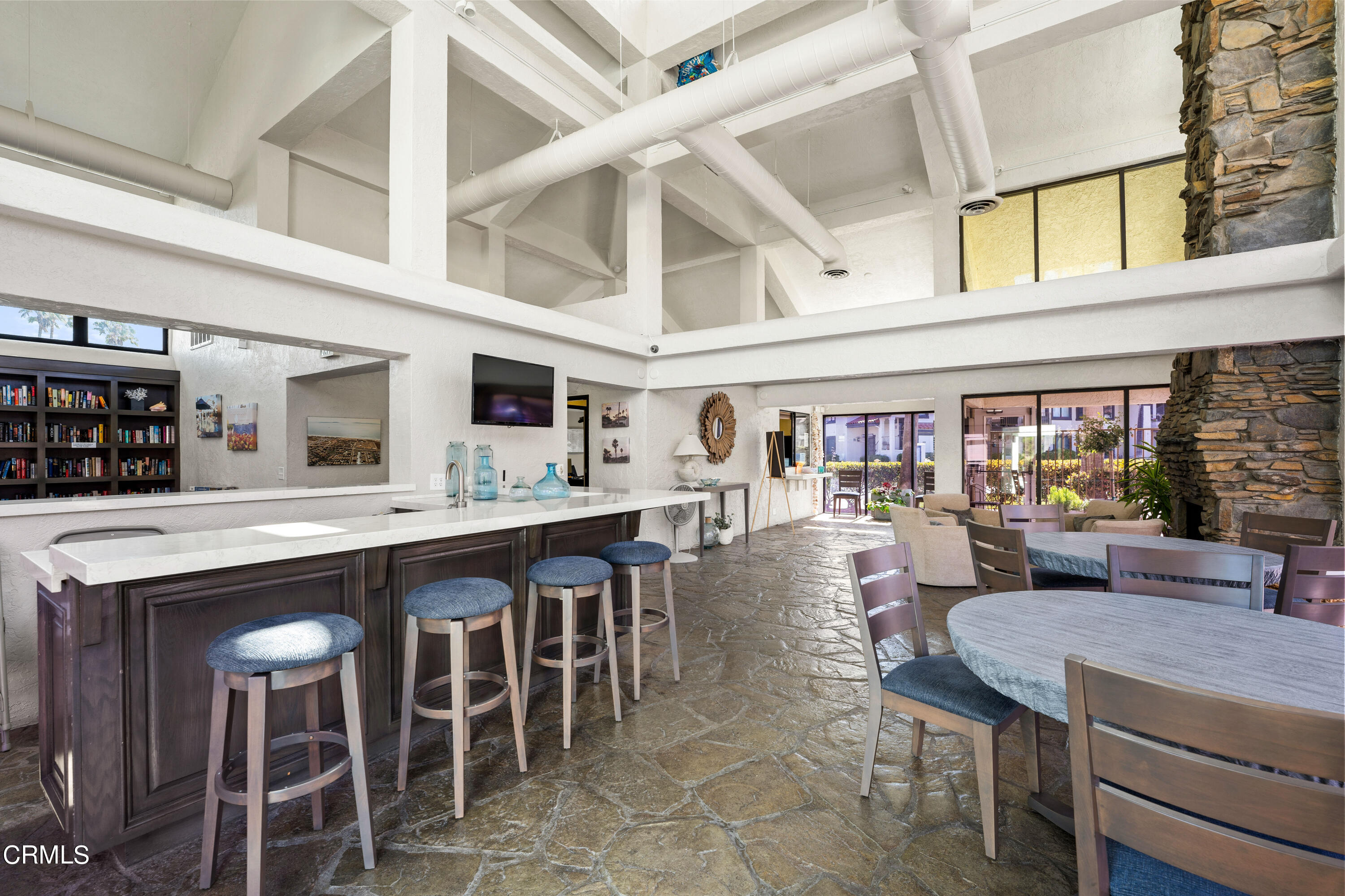 2263 Martinique Lane Oxnard, CA 93035 - Photo 30 of 38 a dining hall with stainless steel appliances granite countertop a dining table and chairs