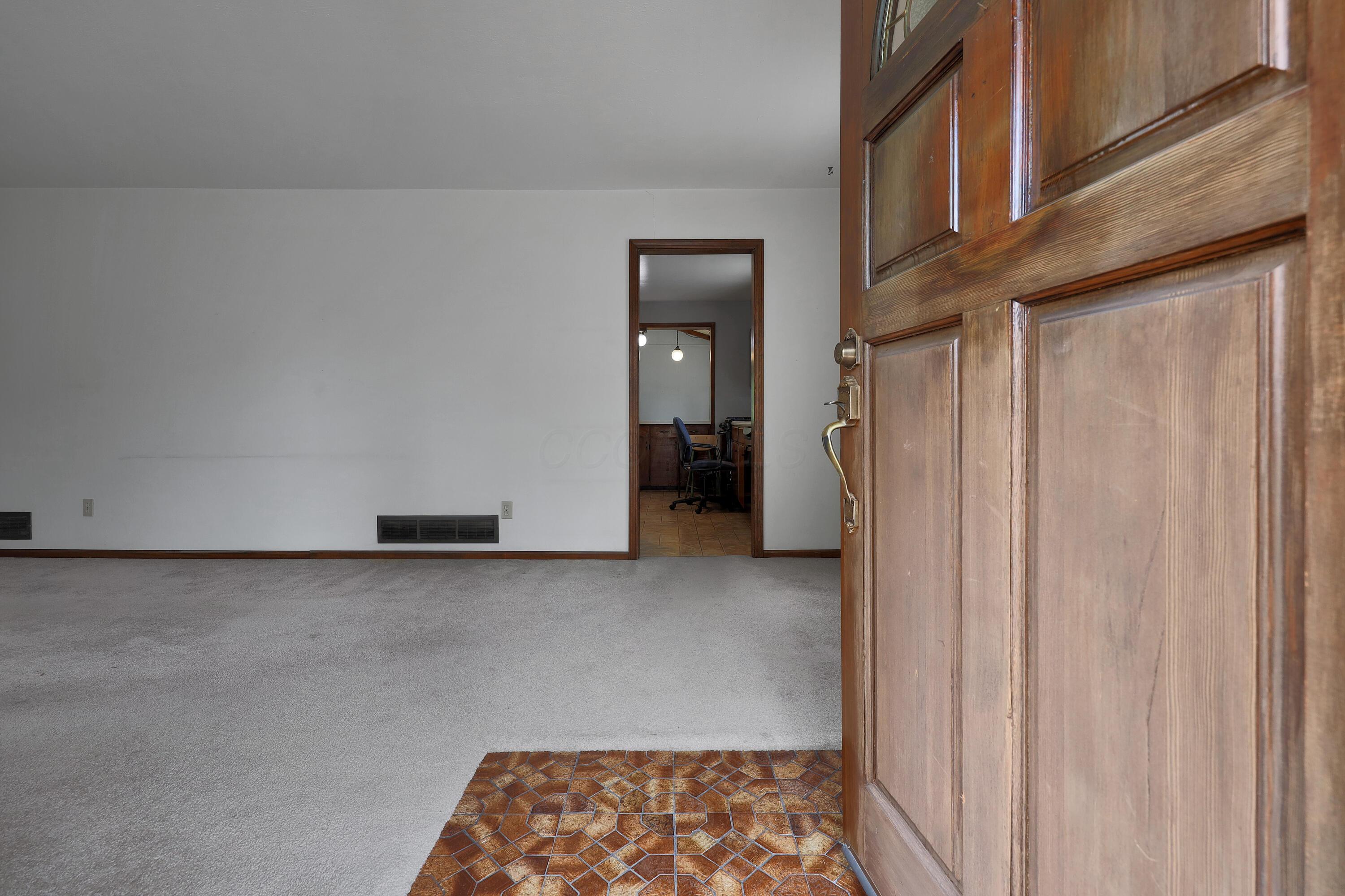 4652 Ludington Road Columbus, OH 43227 - Photo 8 of 43 Front Entrance. Hardwood under Carpet