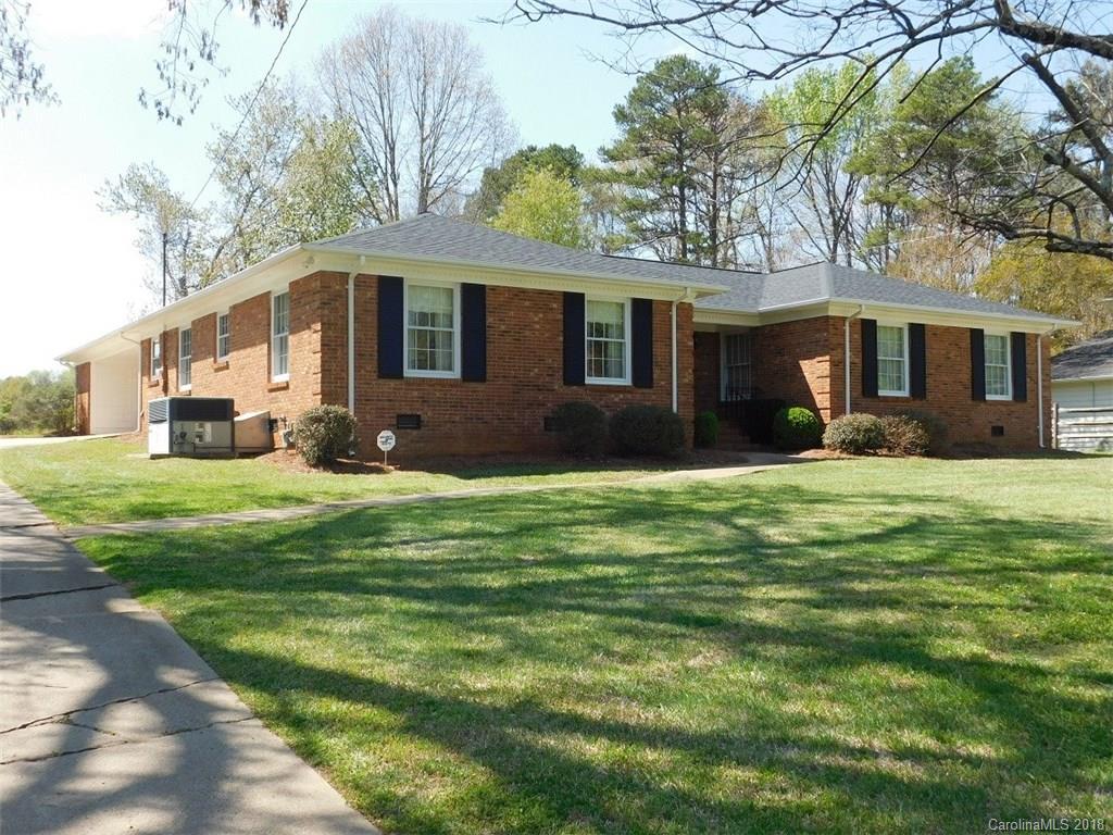 6311 Lake Forest Road East Charlotte, NC 28227 - Photo 1 of 31 a front view of house with yard and green space