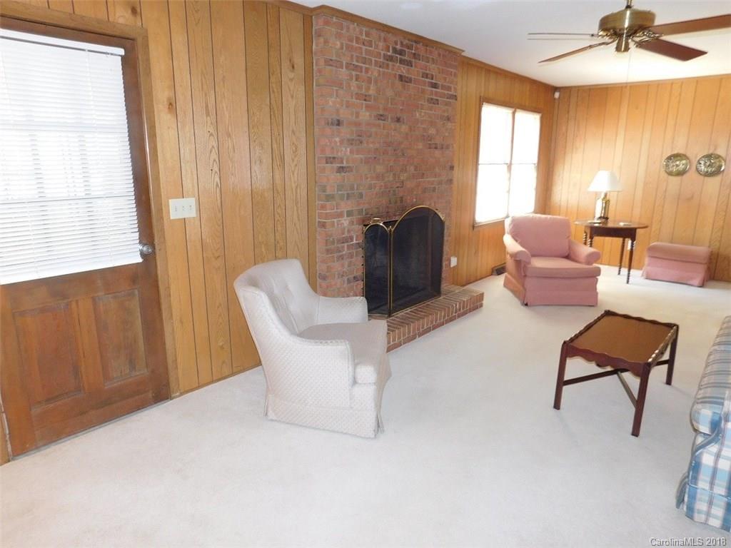 6311 Lake Forest Road East Charlotte, NC 28227 - Photo 13 of 31 a living room with furniture and a window
