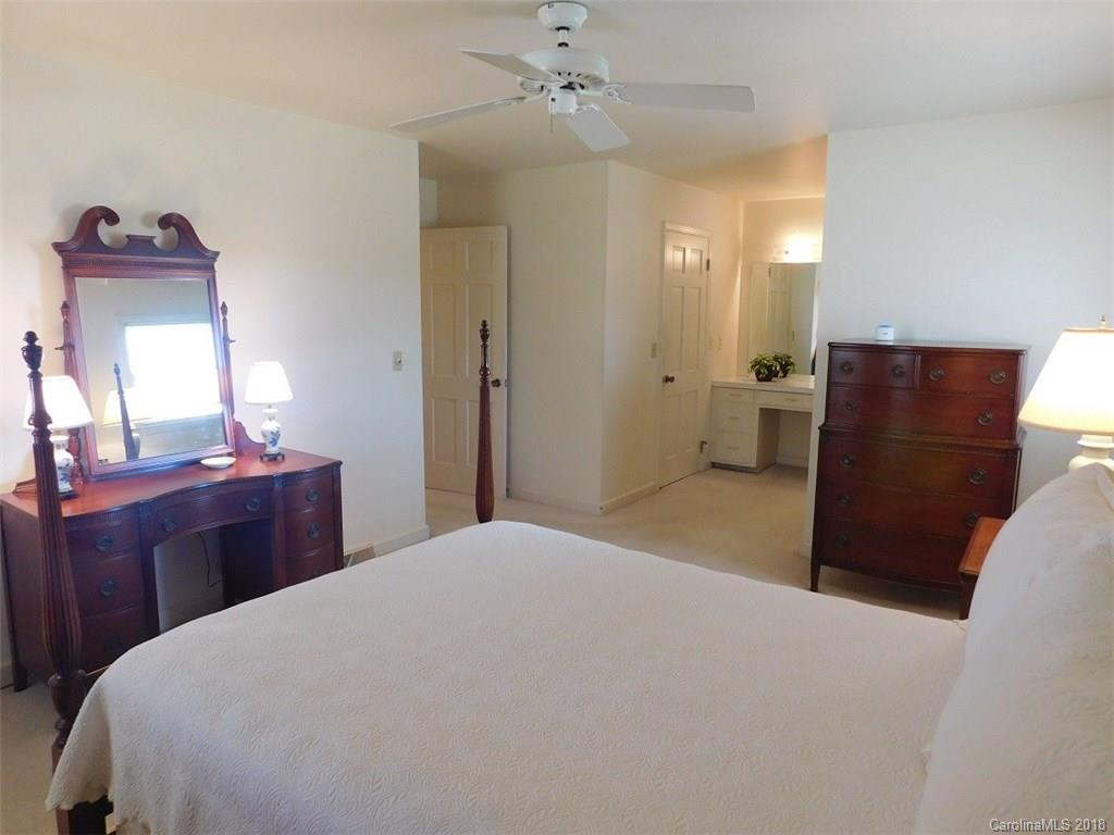 6311 Lake Forest Road East Charlotte, NC 28227 - Photo 20 of 31 a bedroom with a bed and a dresser