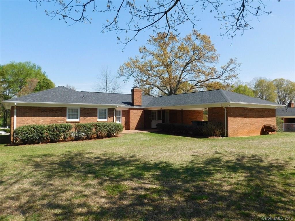 6311 Lake Forest Road East Charlotte, NC 28227 - Photo 6 of 31 a front view of a house with a yard