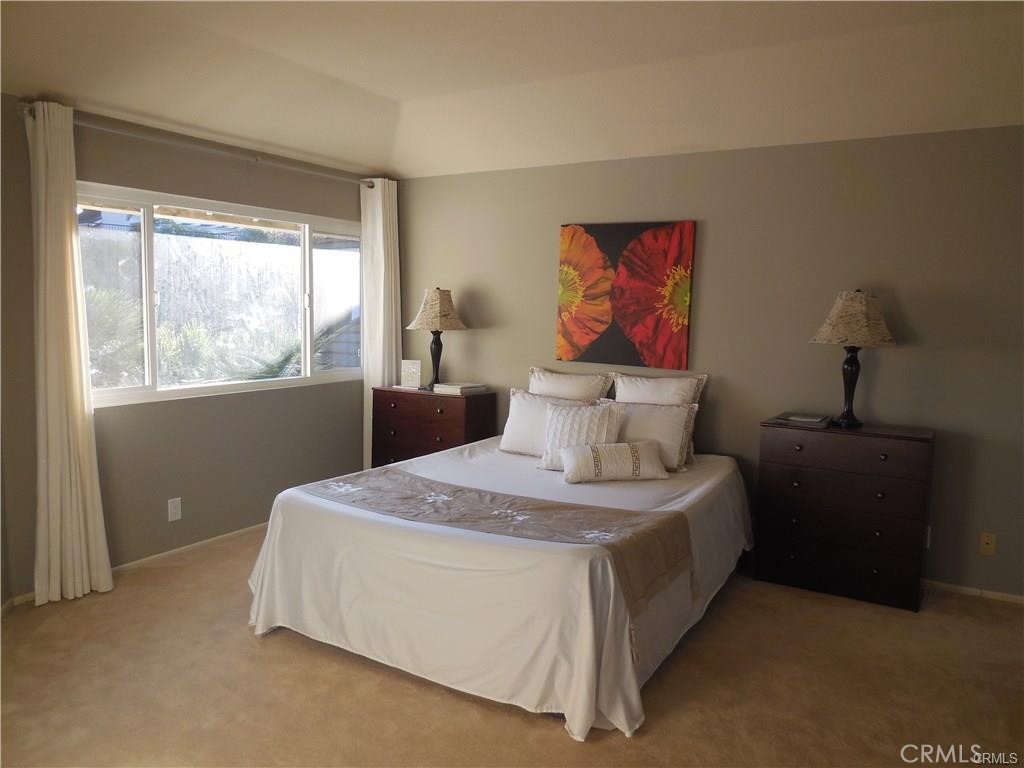 26082 Rio Grande Avenue Laguna Hills, CA 92653 - Photo 14 of 29 a bedroom with a bed and window