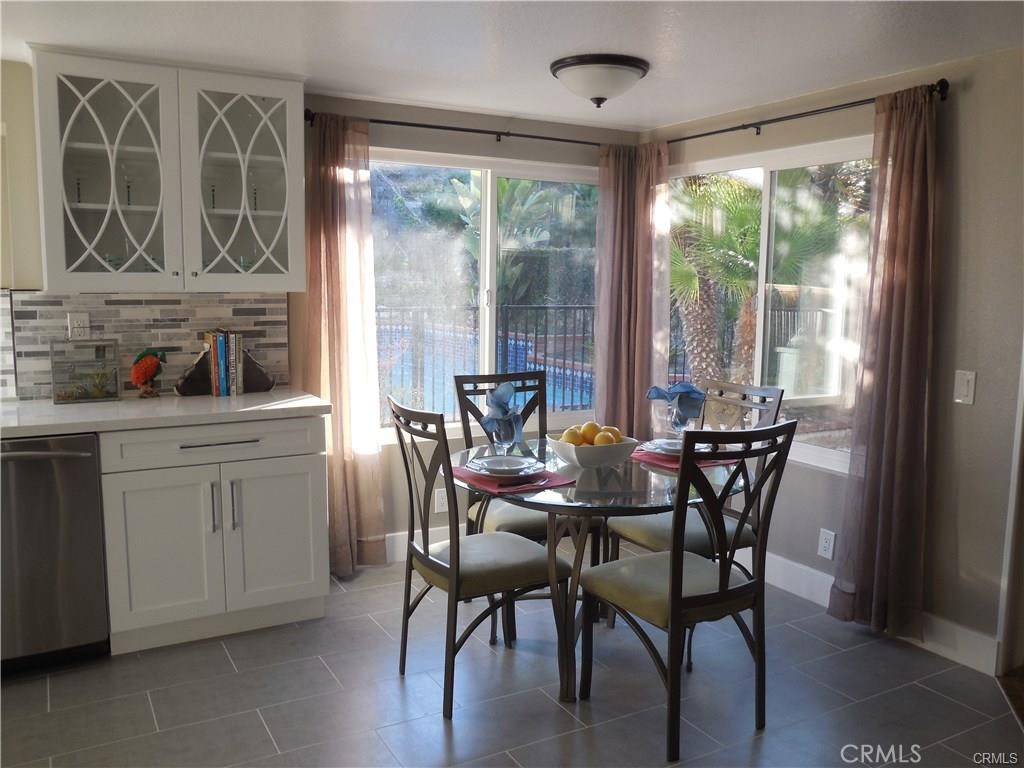 26082 Rio Grande Avenue Laguna Hills, CA 92653 - Photo 15 of 29 a view of a dining room with furniture and windows