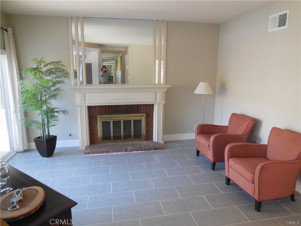 26082 Rio Grande Avenue Laguna Hills, CA 92653 - Photo 16 of 29 a living room with furniture and a fireplace