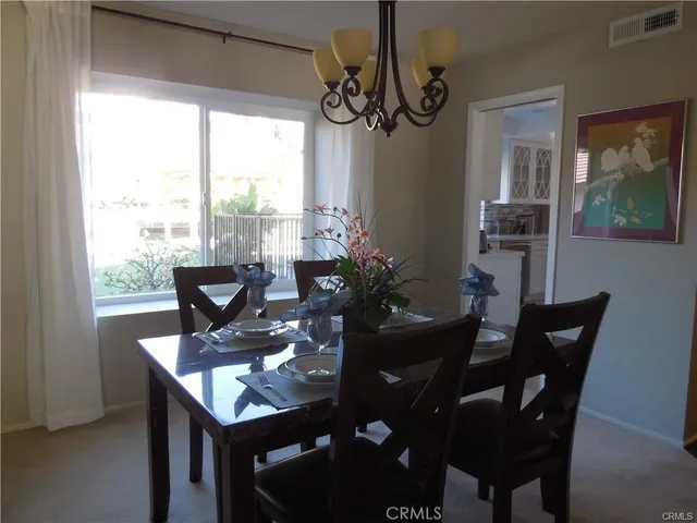 a living room with furniture and a lamp