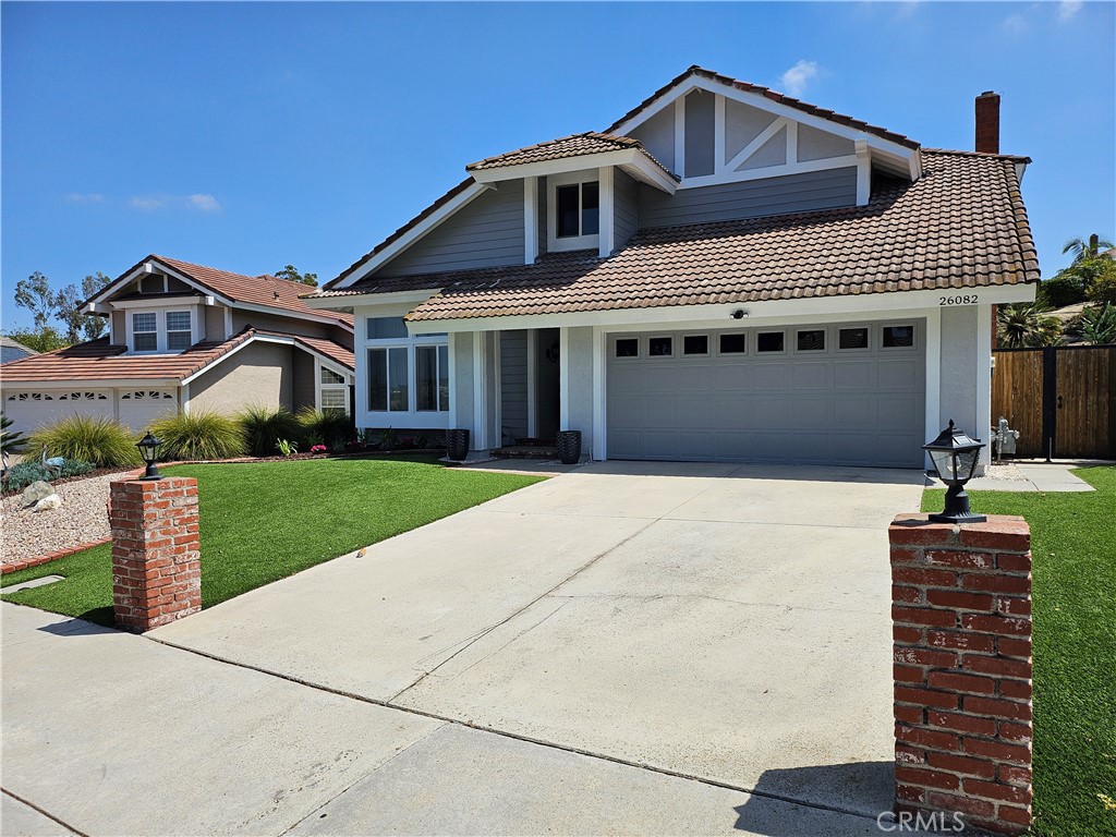 26082 Rio Grande Avenue Laguna Hills, CA 92653 - Photo 2 of 29 a front view of a house with a yard