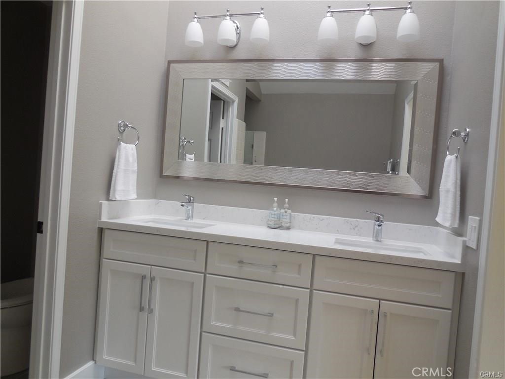 26082 Rio Grande Avenue Laguna Hills, CA 92653 - Photo 21 of 29 a bathroom with a sink and a mirror