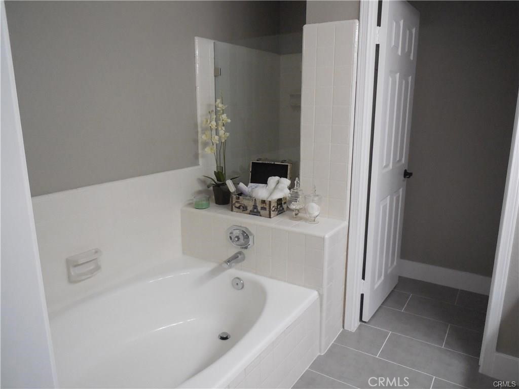 26082 Rio Grande Avenue Laguna Hills, CA 92653 - Photo 23 of 29 a bathroom with a bathtub and a sink