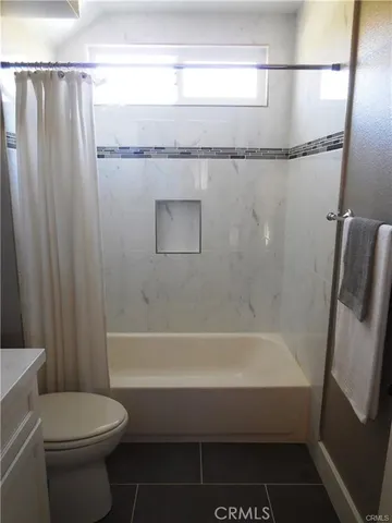 a living room with furniture and a christmas tree