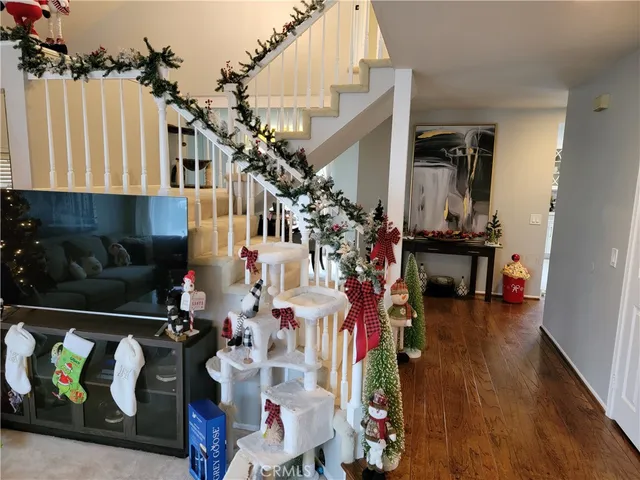 a kitchen with stainless steel appliances a stove sink microwave refrigerator and cabinets