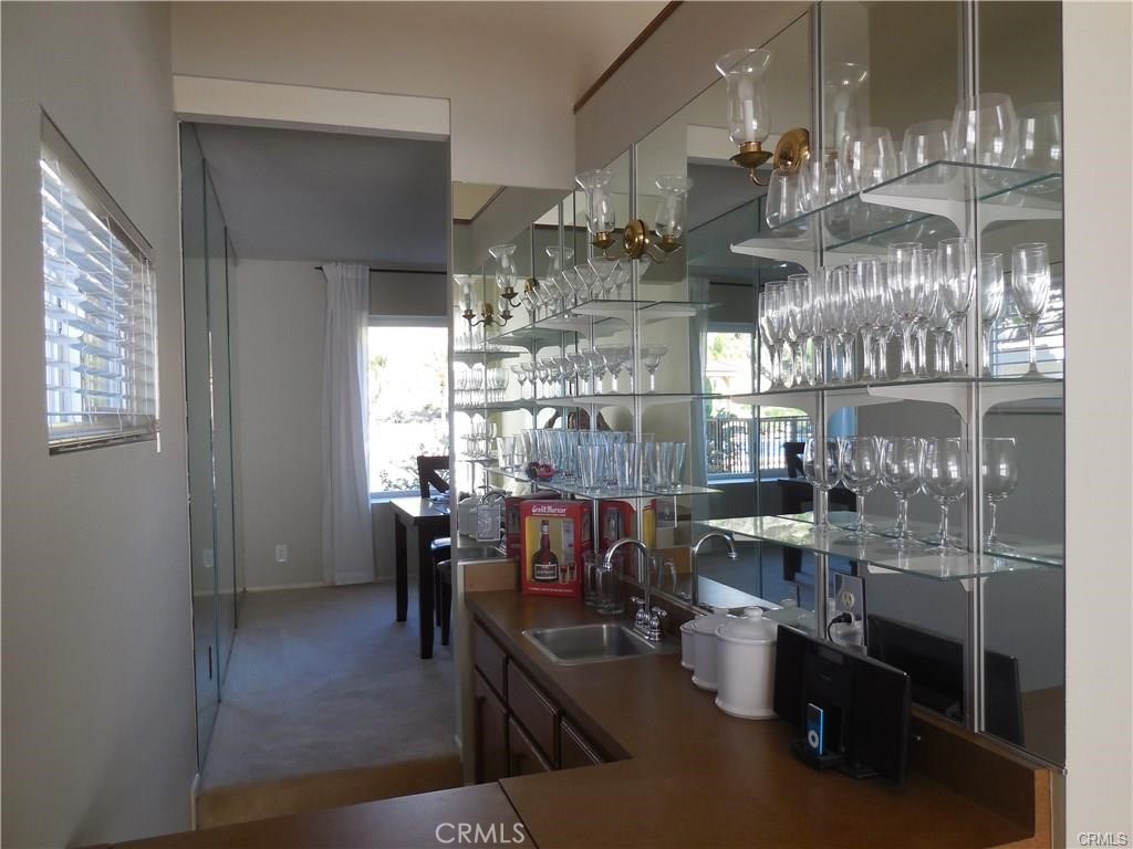 26082 Rio Grande Avenue Laguna Hills, CA 92653 - Photo 29 of 29 a view of a dining room with furniture and chandelier