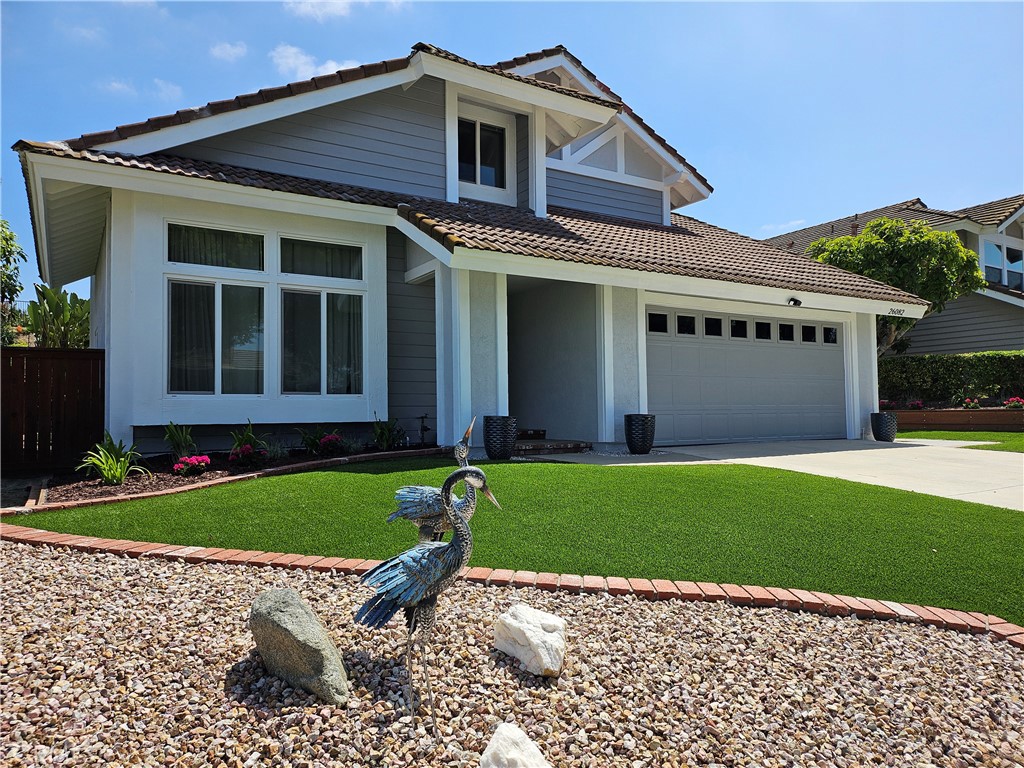 26082 Rio Grande Avenue Laguna Hills, CA 92653 - Photo 4 of 29 a front view of a house with garden