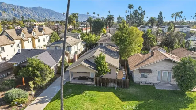 a aerial view of a house with a yard