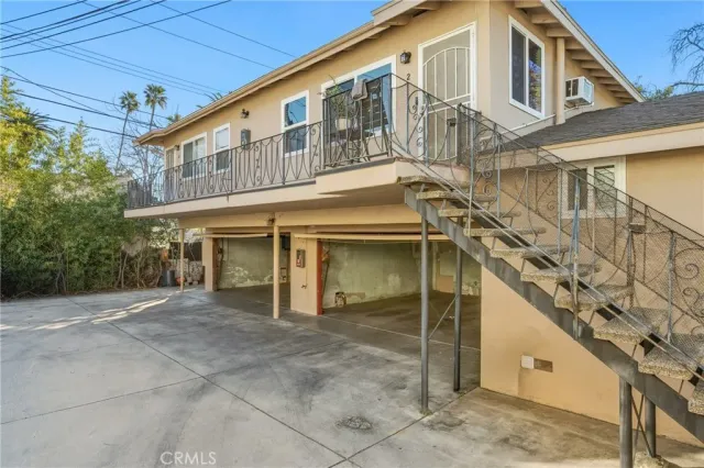 a front view of a building with a yard