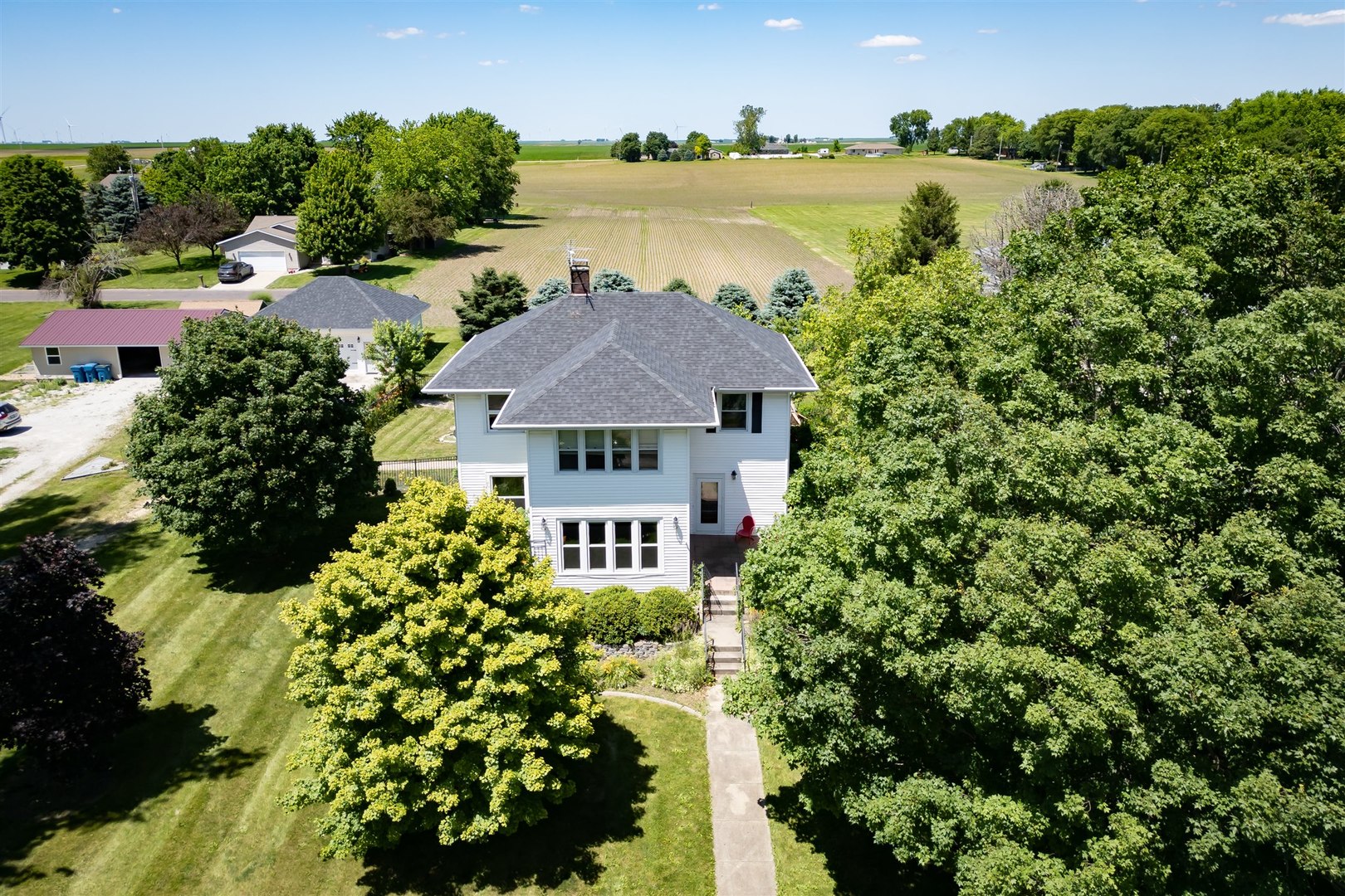 301 West Cooper Street Colfax, IL 61728 - Photo 1 of 69 a view of a house with a yard and a garden