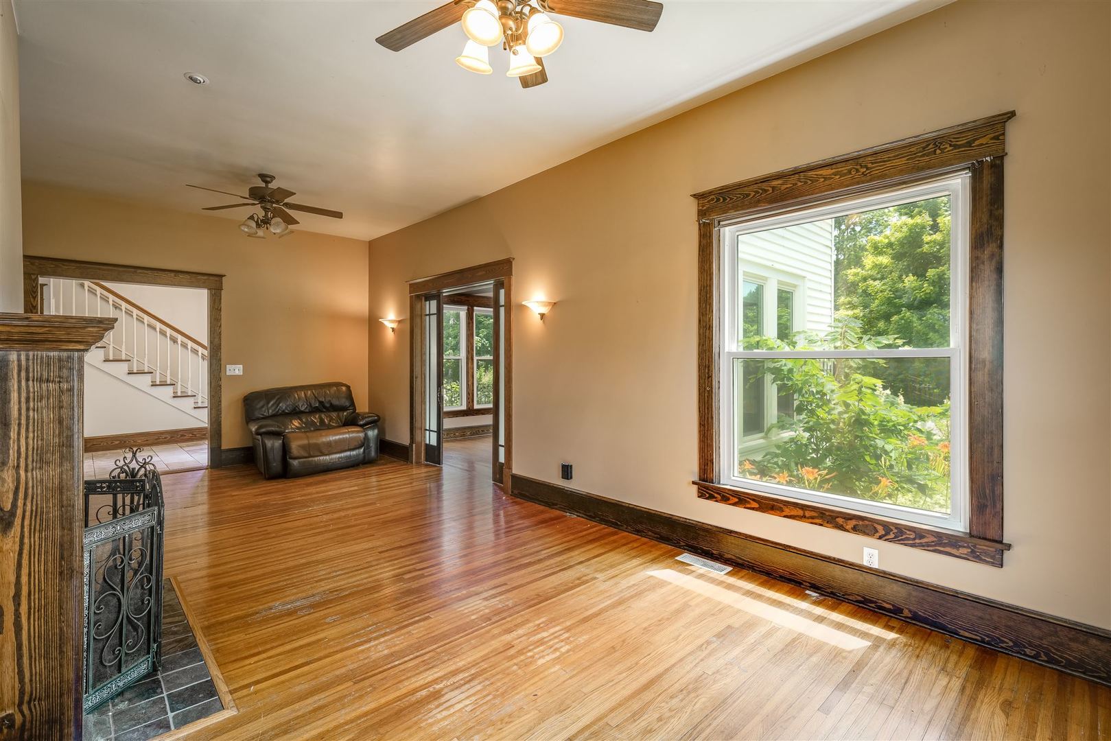 301 West Cooper Street Colfax, IL 61728 - Photo 11 of 69 a view of a livingroom with furniture a ceiling fan and window