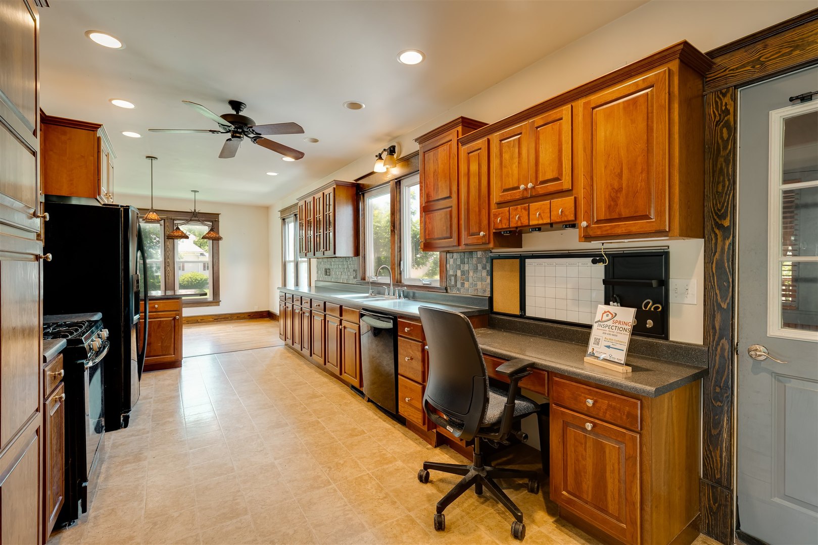 301 West Cooper Street Colfax, IL 61728 - Photo 18 of 69 a view of a workspace with furniture and a kitchen