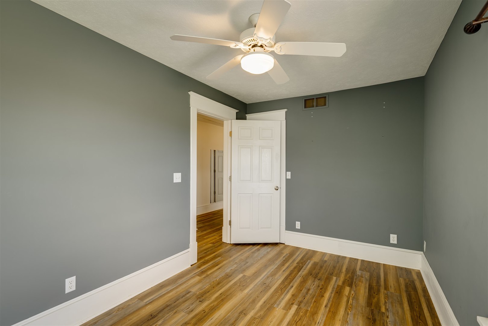 301 West Cooper Street Colfax, IL 61728 - Photo 23 of 69 wooden floor in an empty room