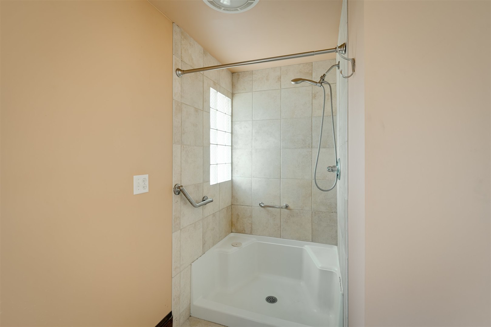 301 West Cooper Street Colfax, IL 61728 - Photo 28 of 69 a bathroom with a shower and a bath tub