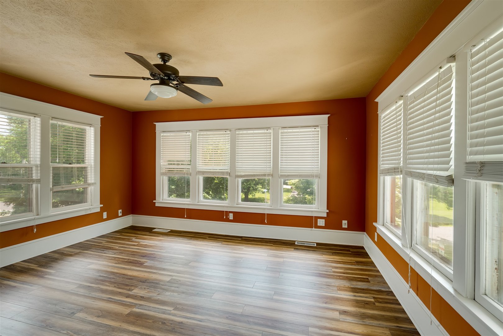 301 West Cooper Street Colfax, IL 61728 - Photo 30 of 69 a view of an empty room with wooden floor and a window