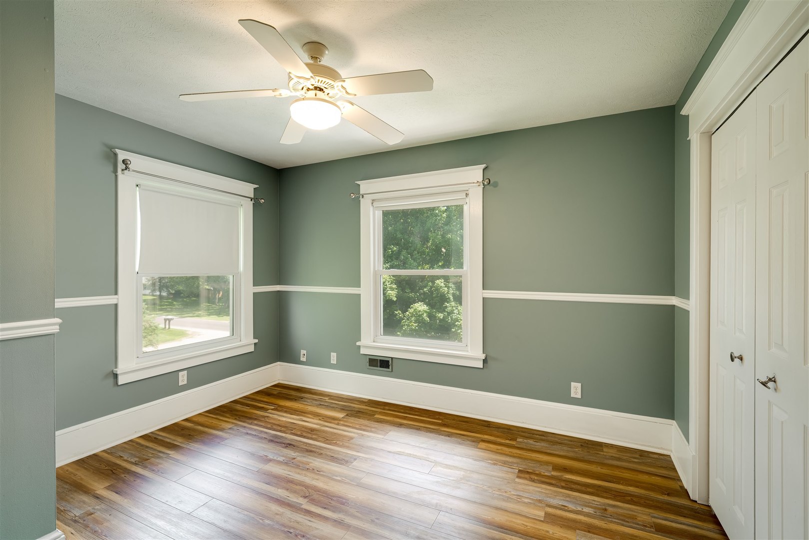 301 West Cooper Street Colfax, IL 61728 - Photo 31 of 69 a view of an empty room with wooden floor and a window
