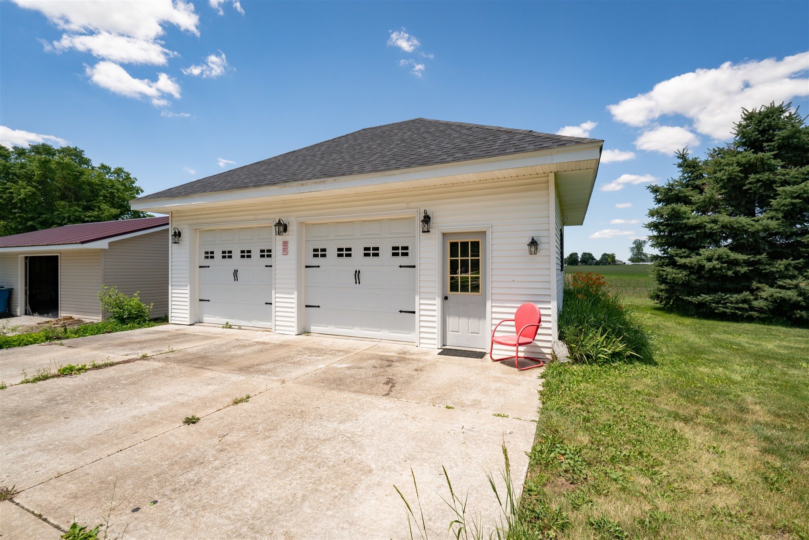 301 West Cooper Street Colfax, IL 61728 - Photo 45 of 69 a front view of a house with a yard and garage