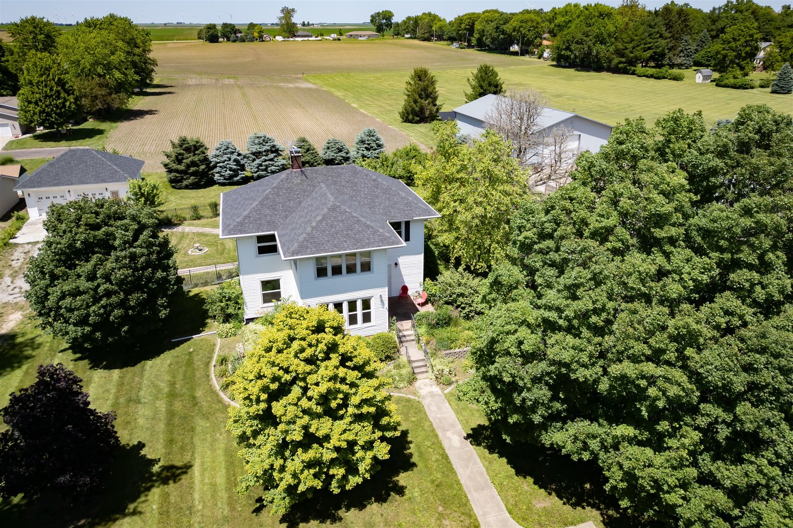 301 West Cooper Street Colfax, IL 61728 - Photo 52 of 69 an aerial view of a house with a lake view