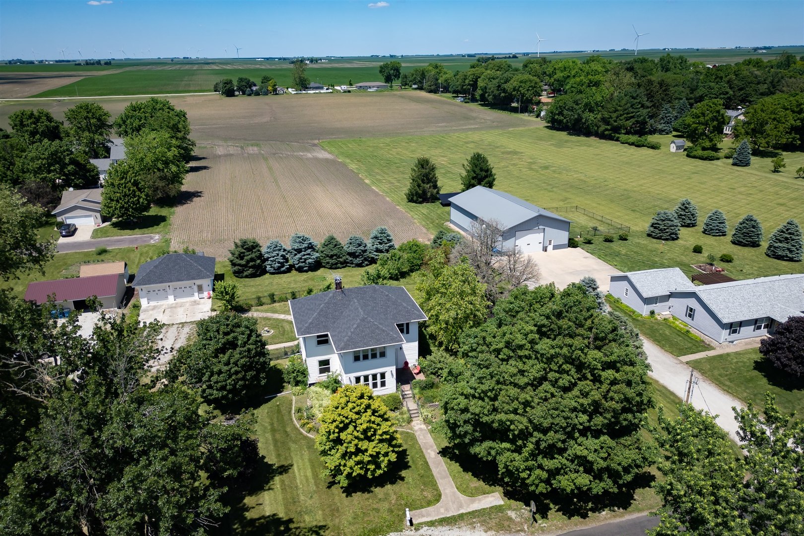 301 West Cooper Street Colfax, IL 61728 - Photo 53 of 69 an aerial view of a house with garden space and outdoor seating
