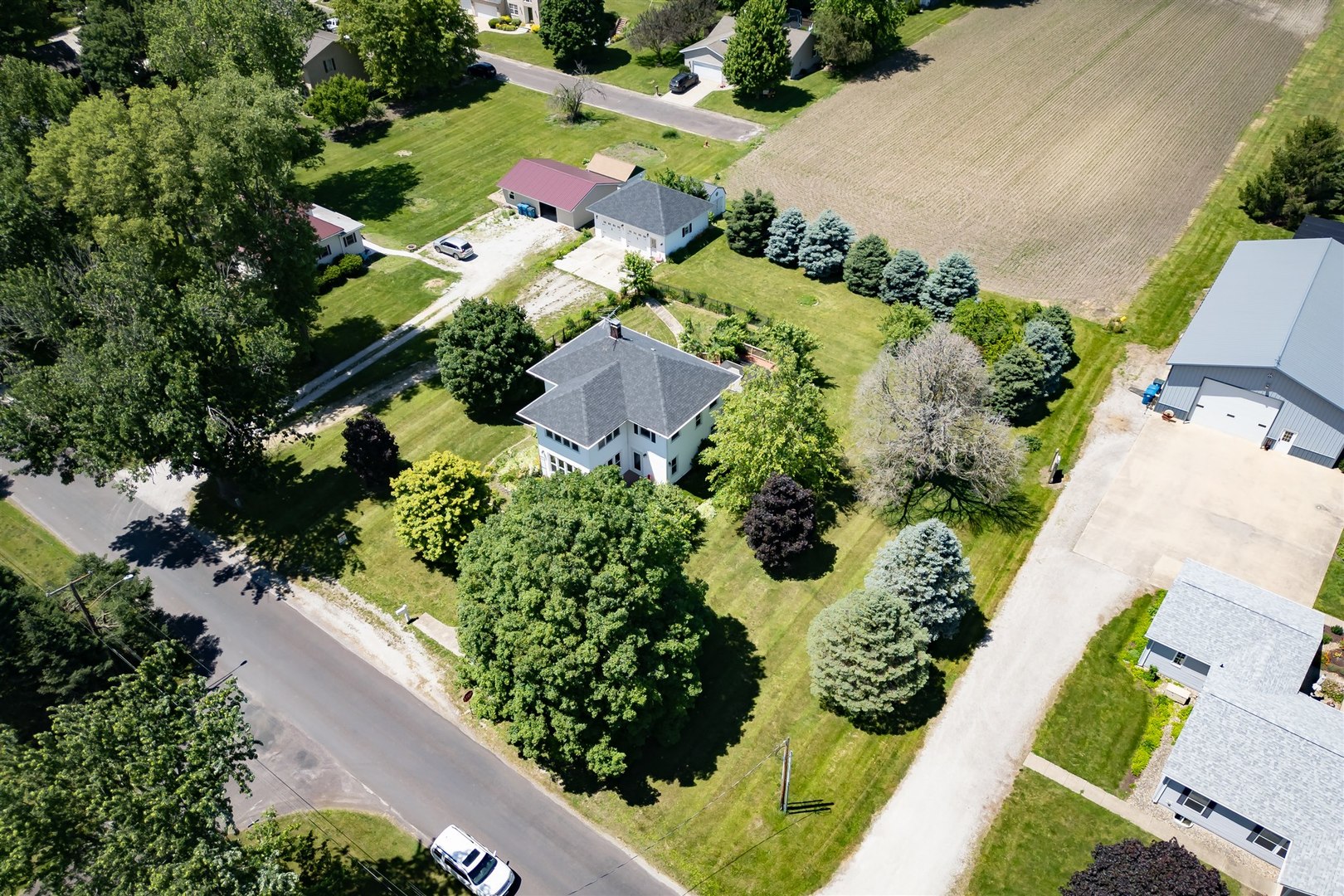 301 West Cooper Street Colfax, IL 61728 - Photo 56 of 69 an aerial view of a house with a yard