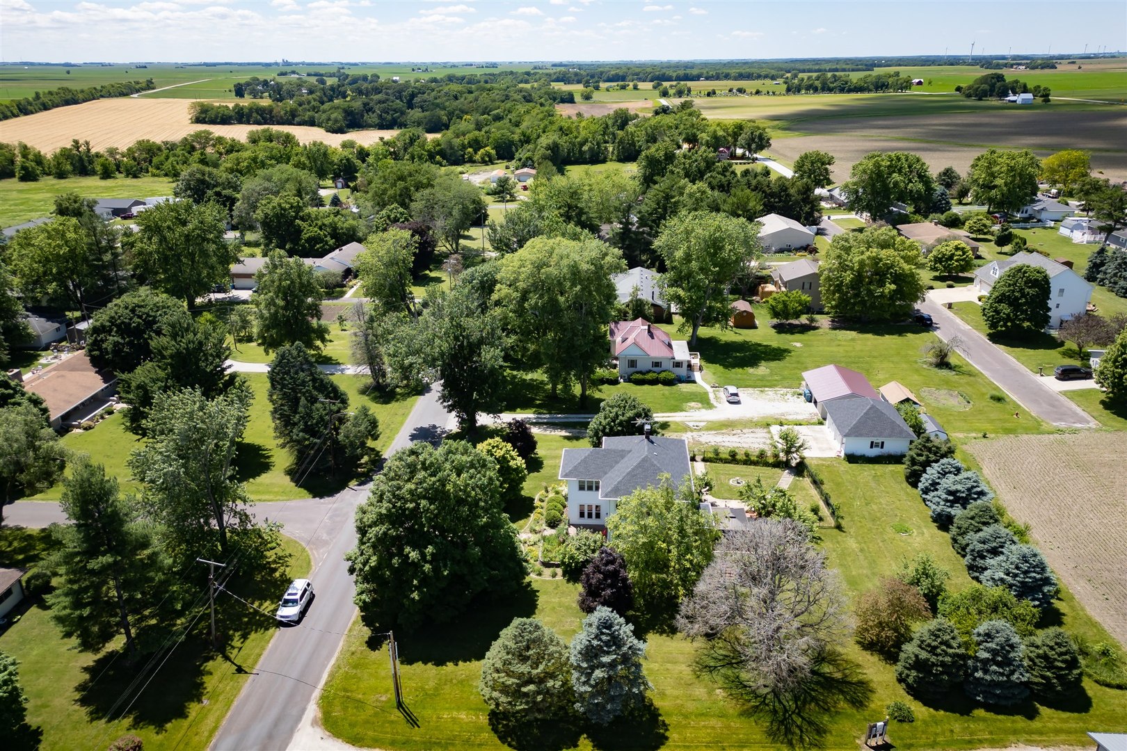 301 West Cooper Street Colfax, IL 61728 - Photo 58 of 69 an aerial view of residential houses with outdoor space and swimming pool