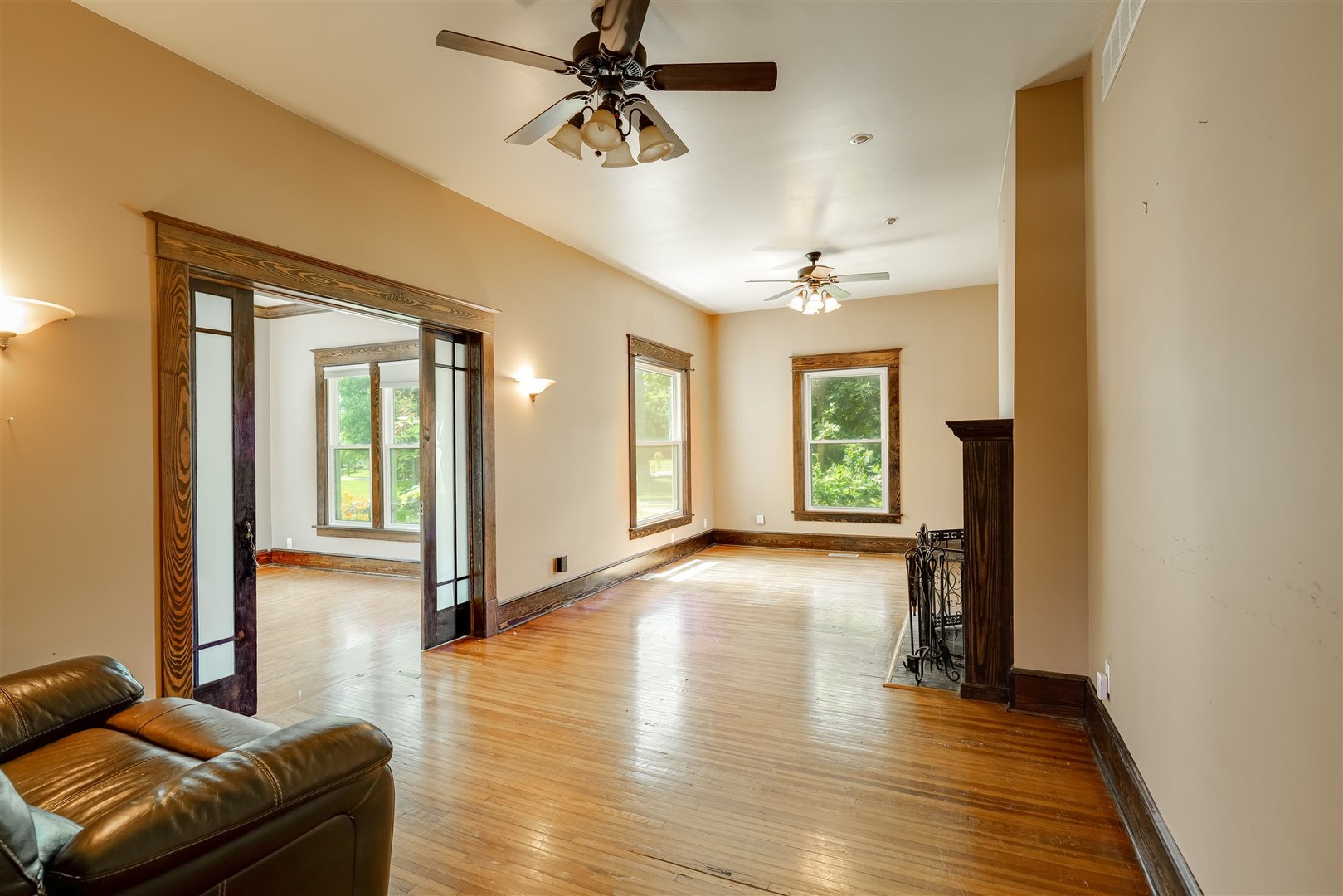 301 West Cooper Street Colfax, IL 61728 - Photo 6 of 69 a view of a livingroom with furniture hardwood floor and a ceiling fan