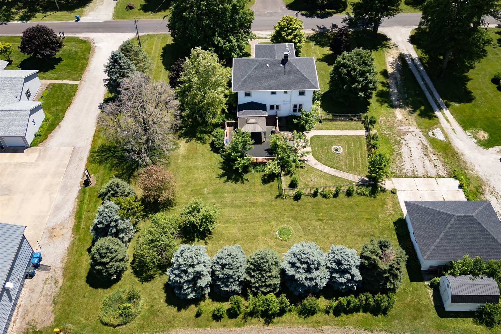 301 West Cooper Street Colfax, IL 61728 - Photo 63 of 69 an aerial view of a house with a garden