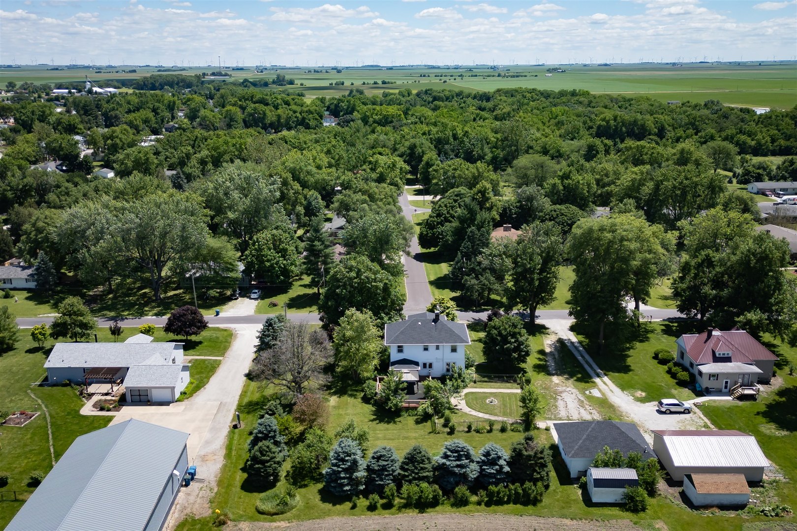 301 West Cooper Street Colfax, IL 61728 - Photo 64 of 69 an aerial view of multiple houses with yard