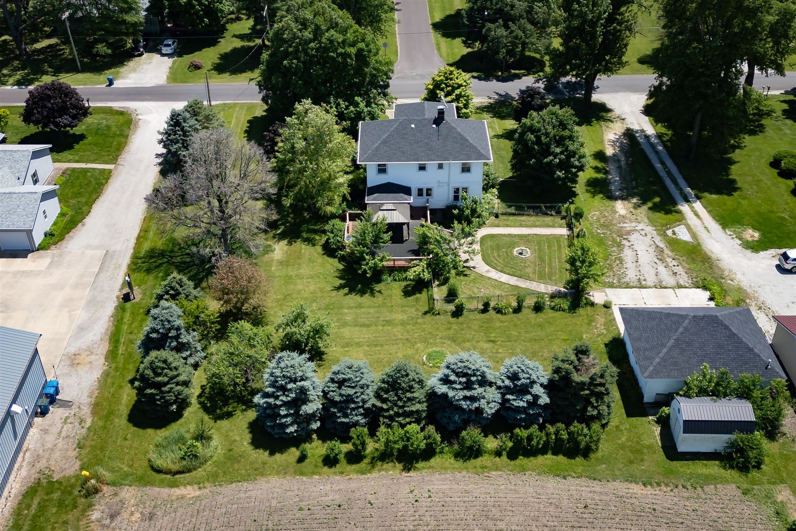 301 West Cooper Street Colfax, IL 61728 - Photo 65 of 69 an aerial view of a house with a garden