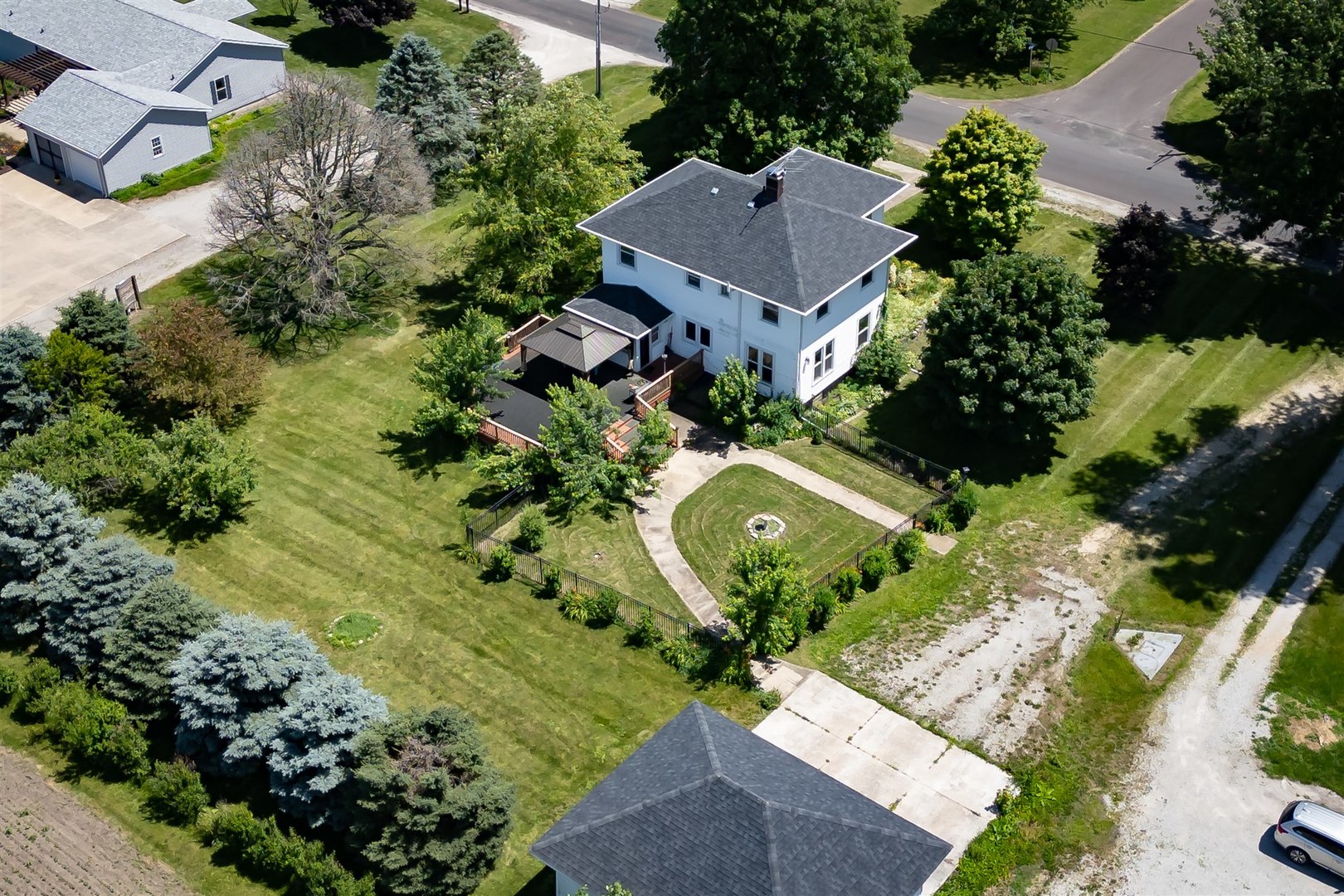 301 West Cooper Street Colfax, IL 61728 - Photo 67 of 69 an aerial view of a house with a yard and garden