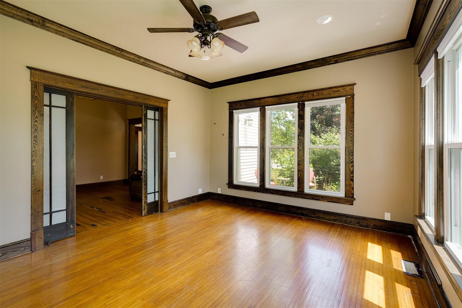 301 West Cooper Street Colfax, IL 61728 - Photo 9 of 69 a view of empty room with wooden floor and fan