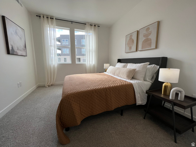 718 West Blue Magic Lane, Unit S201 Midvale, UT 84047 - Photo 8 of 18 Carpeted bedroom with baseboards