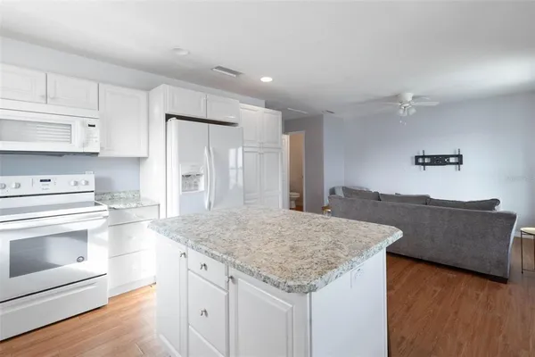 a view of a balcony with wooden floor