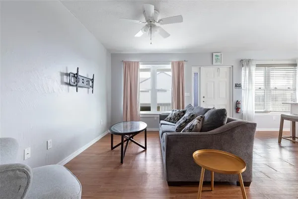 a living room with furniture and a window