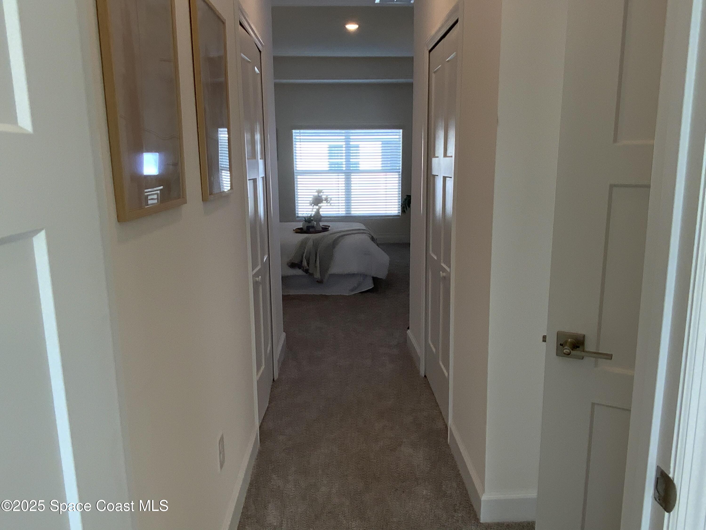1787 Fallon Boulevard Northeast Palm Bay, FL 32907 - Photo 11 of 18 a view of a bedroom from a hallway