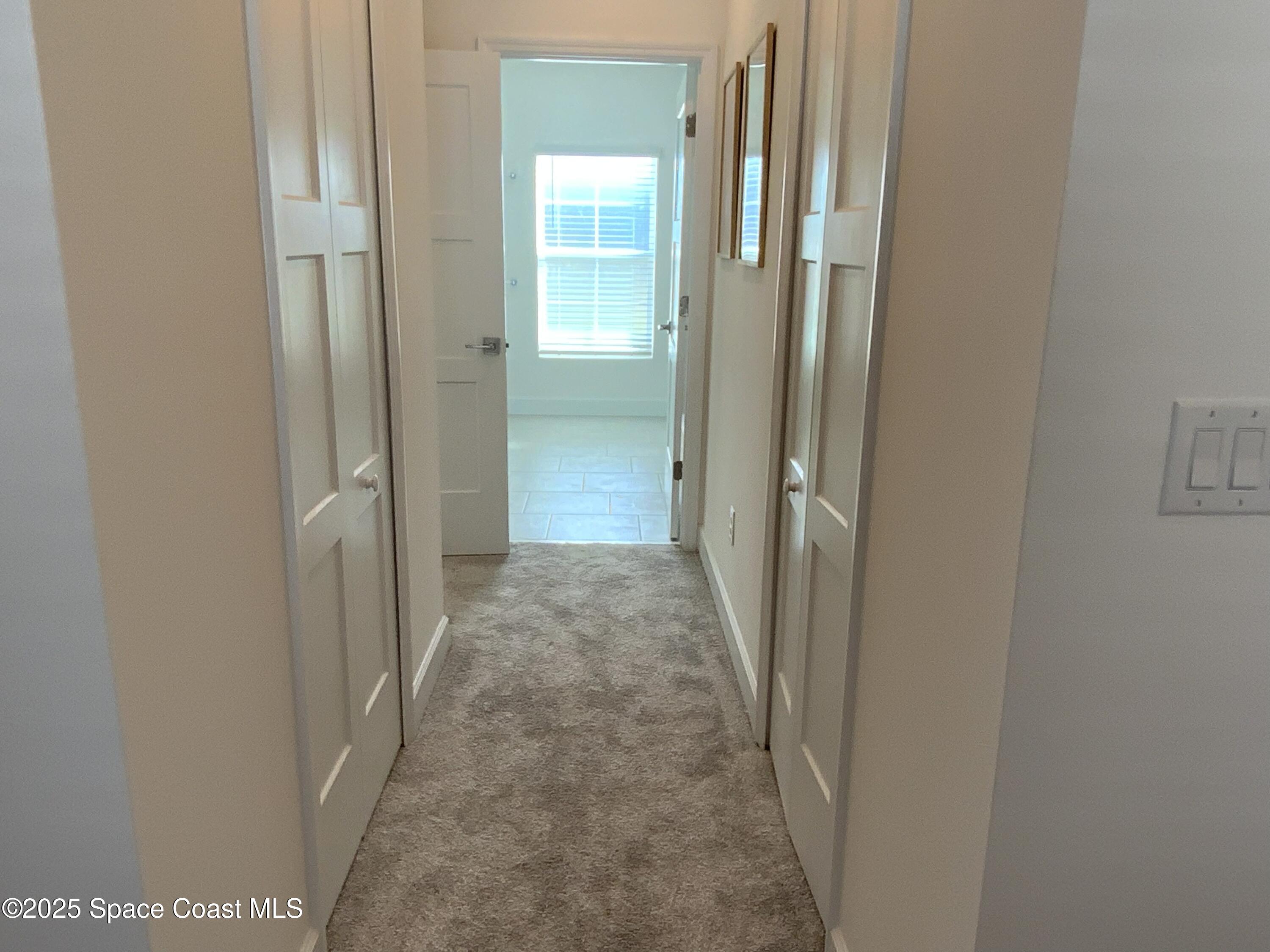 1787 Fallon Boulevard Northeast Palm Bay, FL 32907 - Photo 12 of 18 a view of a bathroom from a corridor
