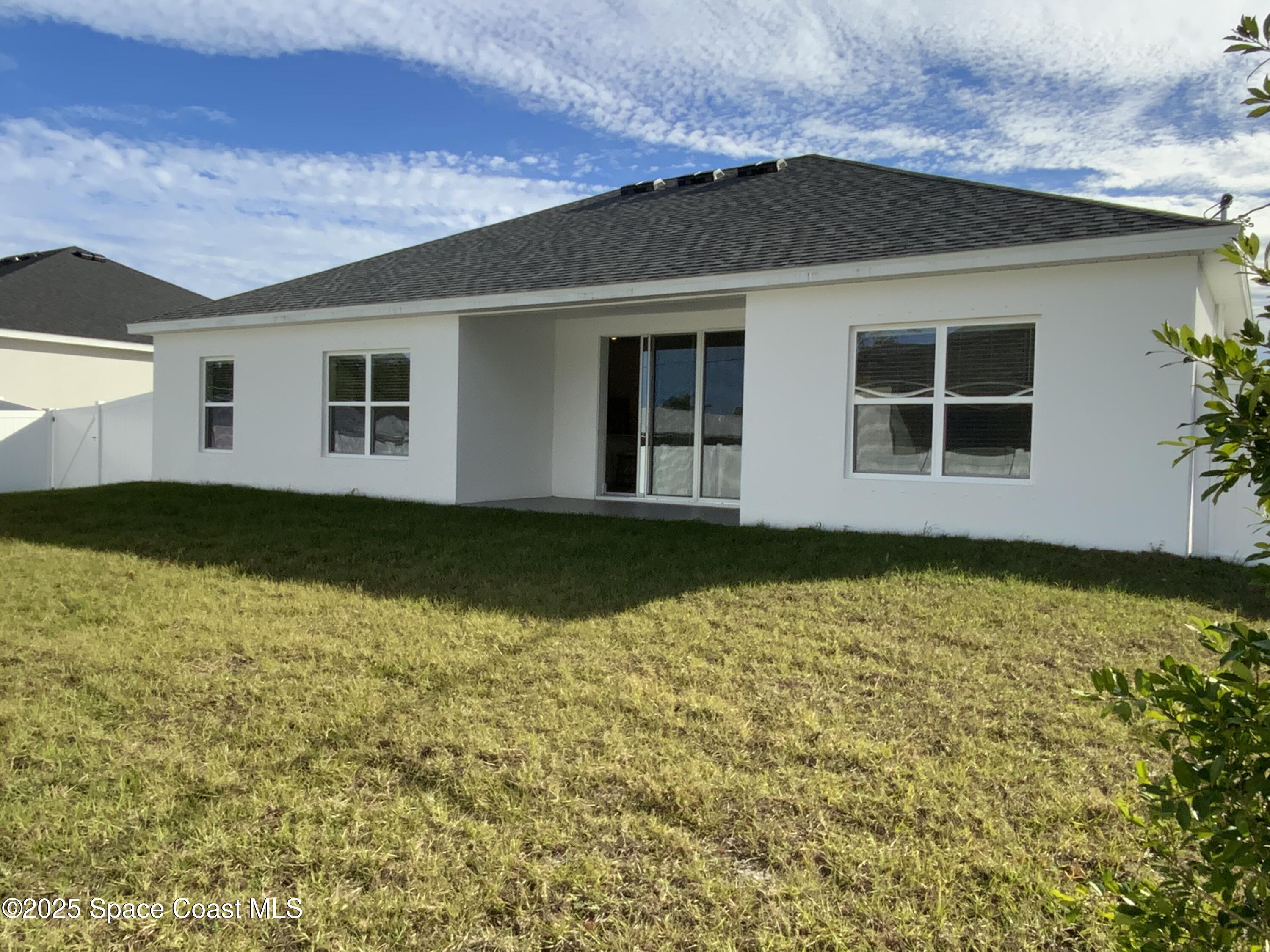 1787 Fallon Boulevard Northeast Palm Bay, FL 32907 - Photo 16 of 18 a house view with a garden space