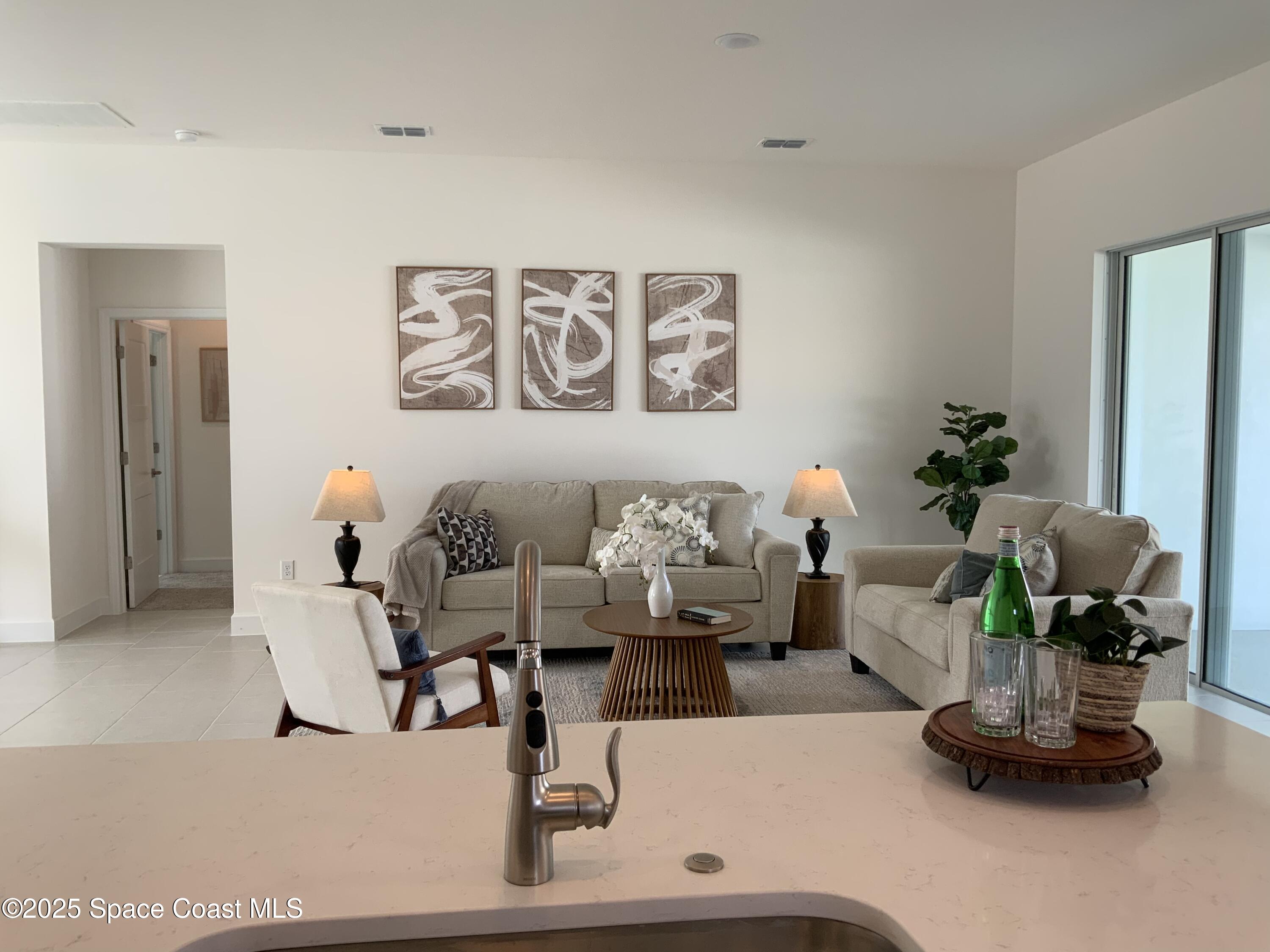 1787 Fallon Boulevard Northeast Palm Bay, FL 32907 - Photo 5 of 18 a living room with furniture