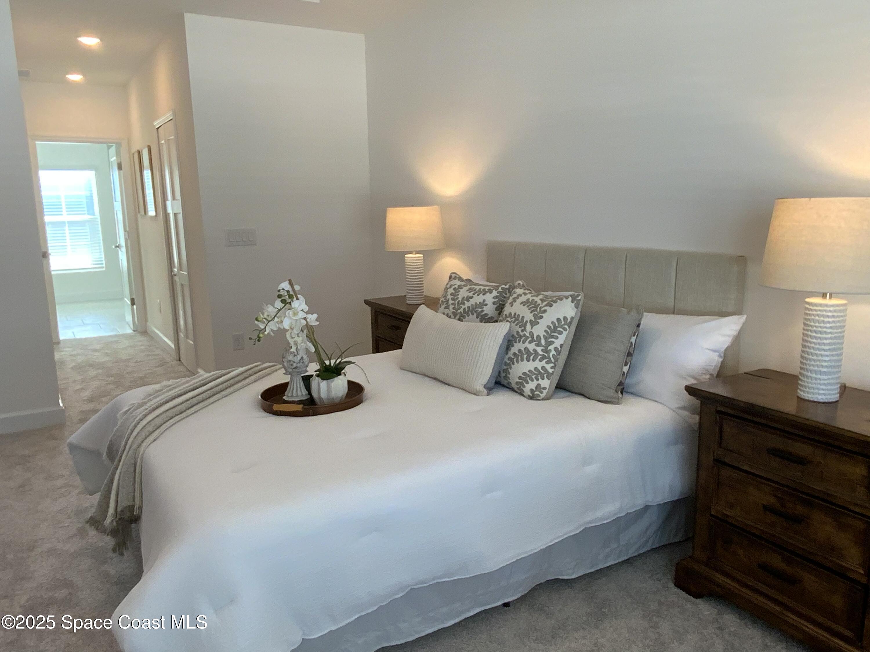 1787 Fallon Boulevard Northeast Palm Bay, FL 32907 - Photo 9 of 18 a bedroom with a bed and window