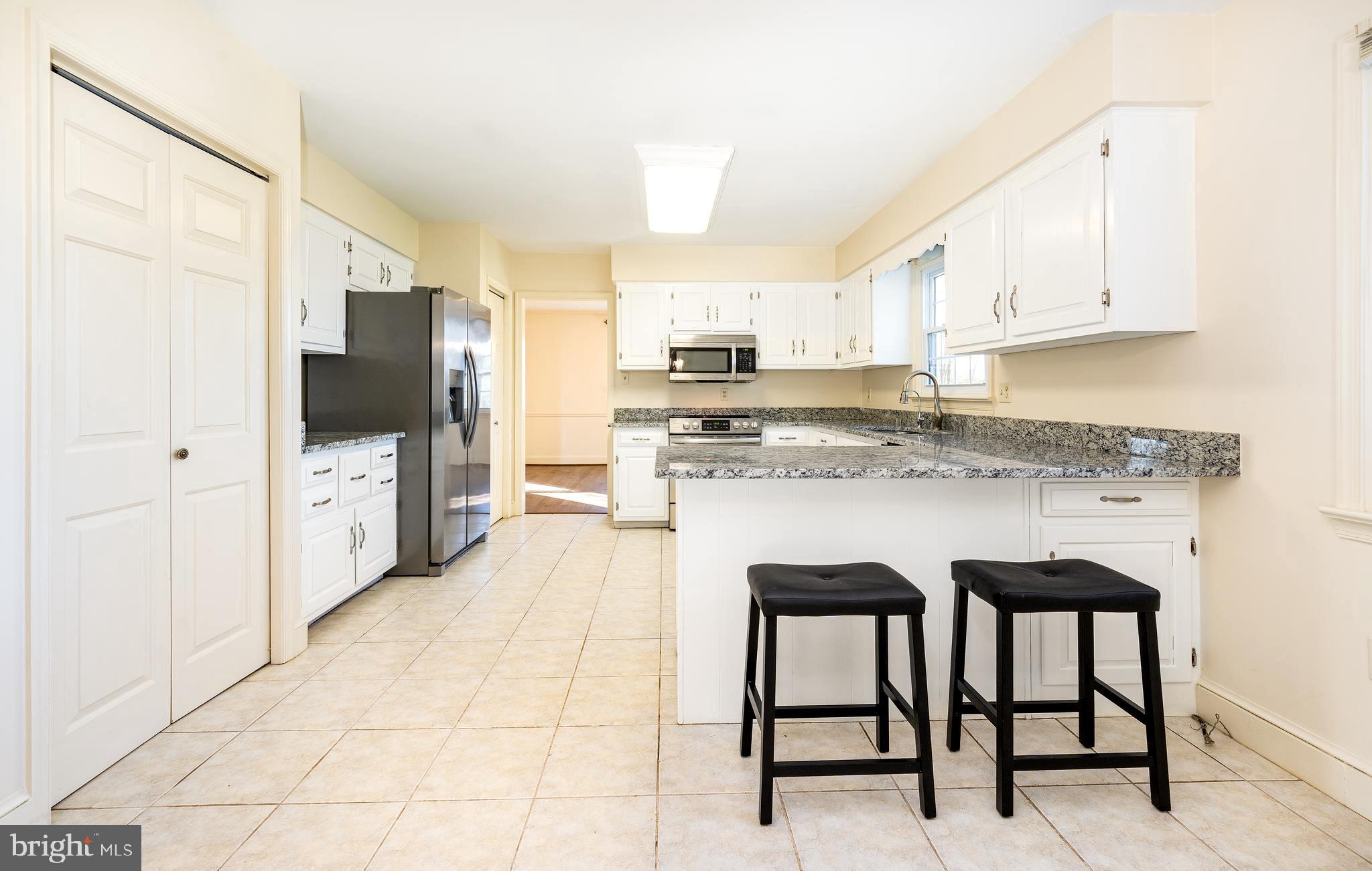 5942 Broad Run Road Jefferson, MD 21755 - Photo 2 of 45 Kitchen w/ Granite, S/S Appl & Painted White Cabs
