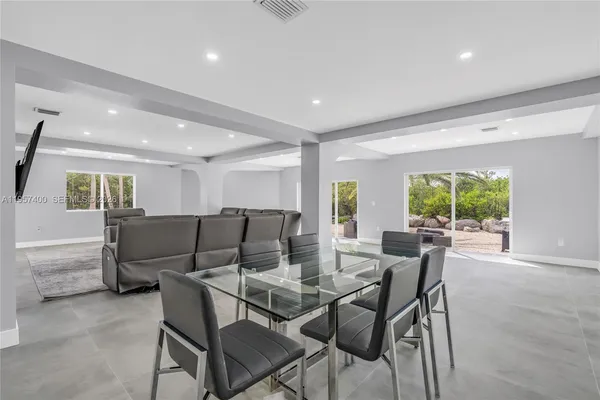 a view of a dining room with furniture window and outside view