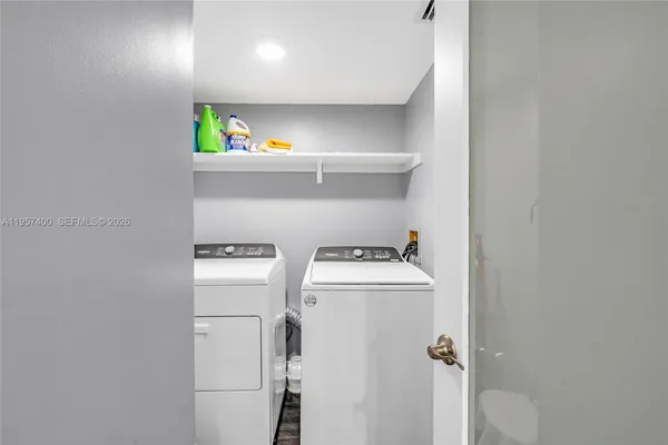 a utility room with dryer and washer